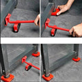 Red furniture moving tool with wheels lifting and sliding a heavy metal chair on gray floor tiles