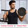 Man in black tank top holding tummy trimmer and round twister plate fitness equipment