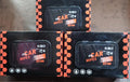 Three boxes of black and orange car wipes packaging with 80 wipes for interior cleaning